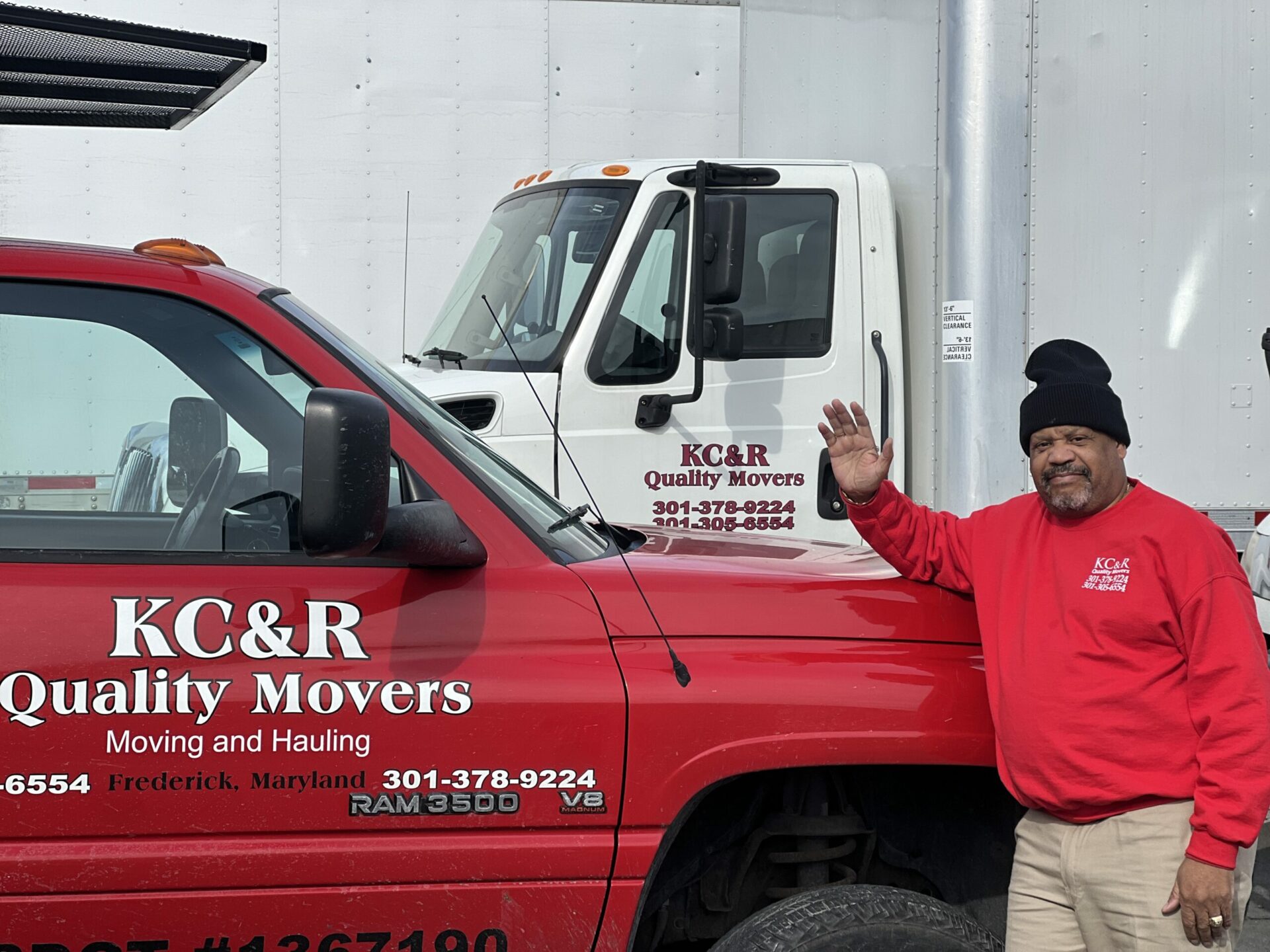 mover standing next to a moving truck